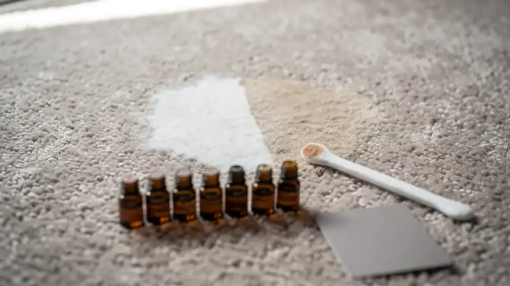 Taupe carpet with a pale bleach spot beside a row of amber dye bottles and a swatch card
